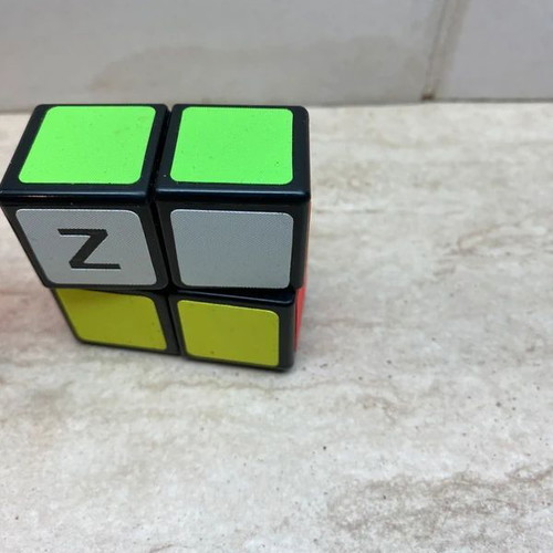 Set of 4 cubes like new, including 3x3, 3x3 mini, and 2x1