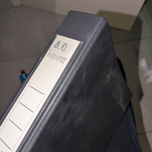 Black folder like new with 25 phone cards and cards
