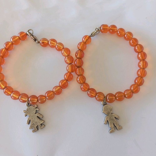 Orange bracelets set of 2 with boy and girl charms