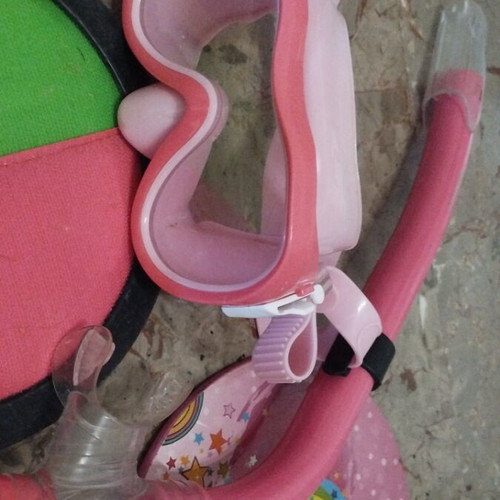 Beach items used, pack with masks, rackets, balls, bucket, sunglasses