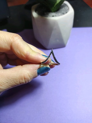 Ring used, gold color, pointy with black stones