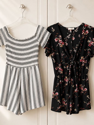 Set of two playsuits rompers like new, black floral and striped Bershka