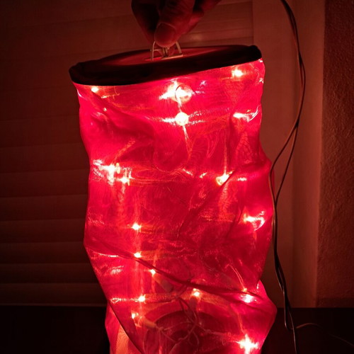 Electric decorative lantern with red fabric and LED lighting