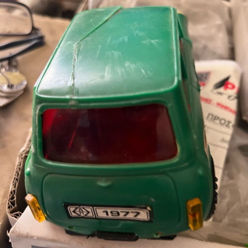 Mini Cooper wind-up toy used, with some broken parts