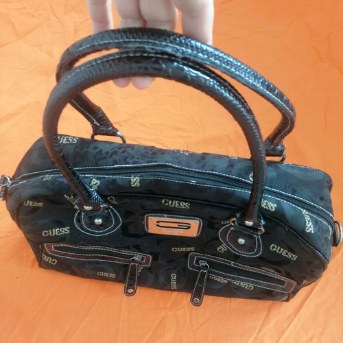 Guess vintage black handheld bag used with silver and gold details