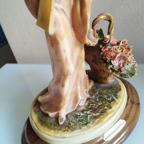 Vintage Italian decorative statue of a girl with roses, used