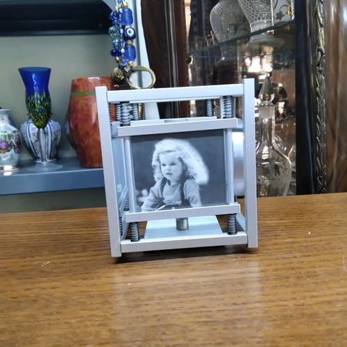 Quartz table clock silver color rotating, like new