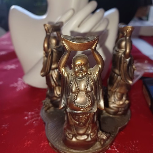 Asian candlestick with 3 smiling figures used, bronze finish