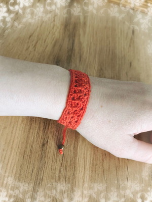 Knitted bracelet new red with beads made of cotton thread