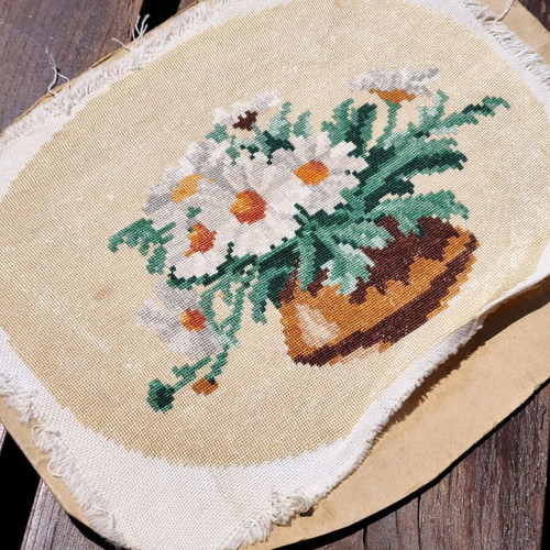 Vintage needlepoint with embroidered daisy bouquet used