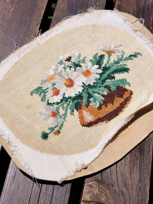 Vintage needlepoint with embroidered daisy bouquet used