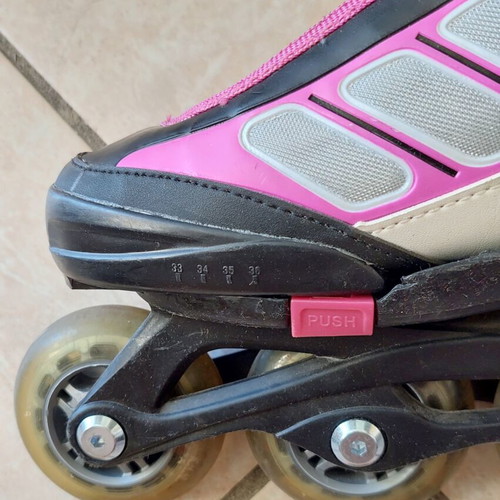 Rollers adjustable size 33-36, like new, black/fuchsia