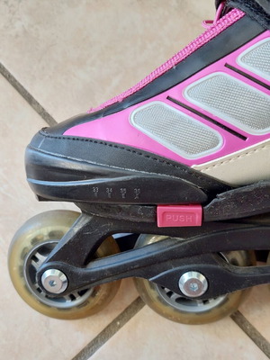 Rollers adjustable size 33-36, like new, black/fuchsia