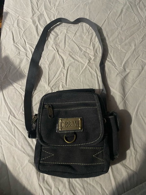 OR&MI black shoulder bag used with metal details