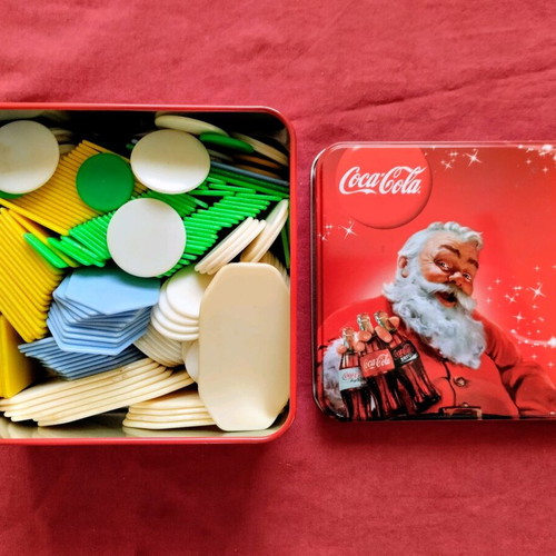 Poker chips used with vintage metal storage tin