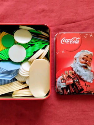 Poker chips used with vintage metal storage tin
