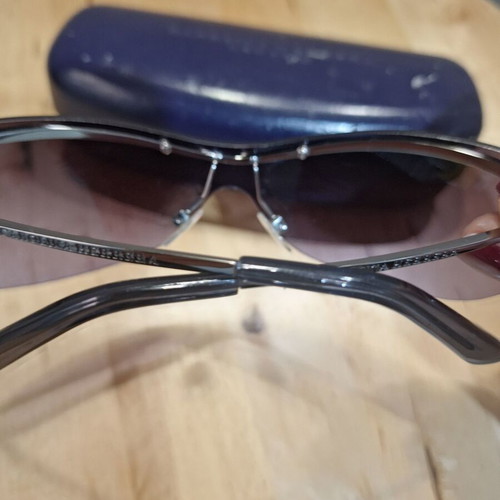 Carolina Herrera vintage women's sunglasses used, purple butterfly design