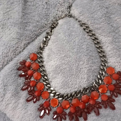 Statement necklace made of steel with red and burgundy stones new