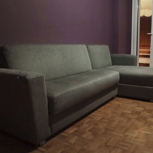Corner sofa bed used with storage and removable burgundy cover