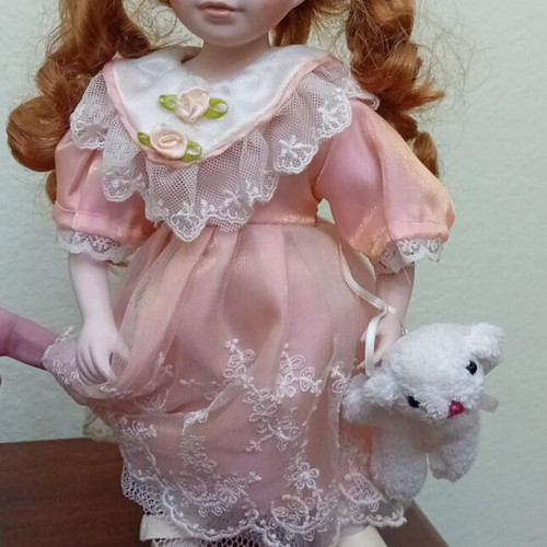 Porcelain doll like new, height 32cm