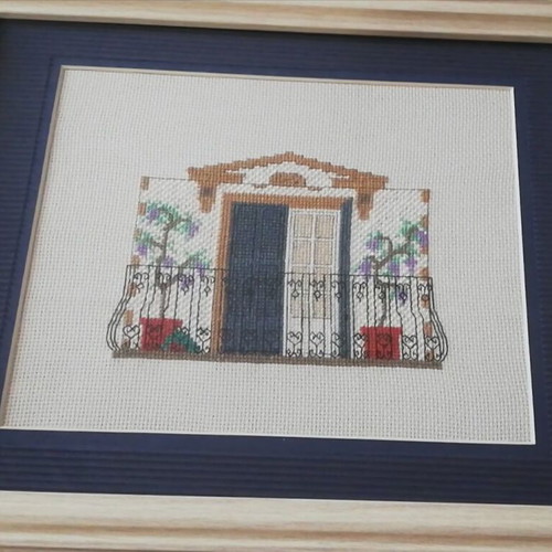 Embroidered textile painting with wooden frame
