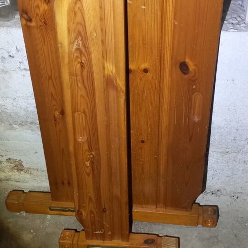 Wooden single bed used in functional condition