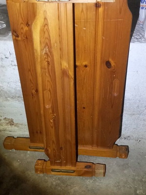 Wooden single bed used in functional condition