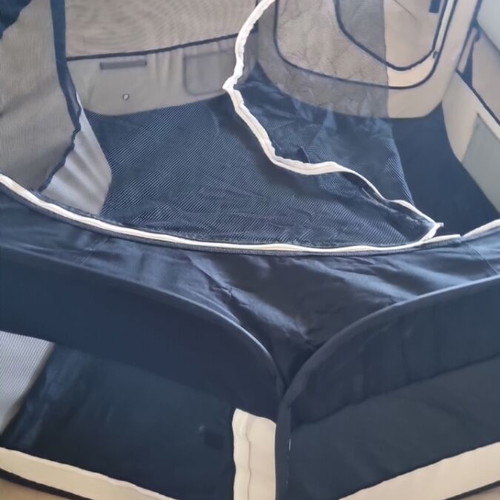 Foldable pet playpen used for dogs and rabbits with mesh cover and two zipper doors