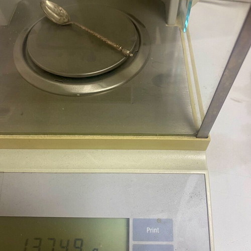 Silver spoon used, approximately 14g