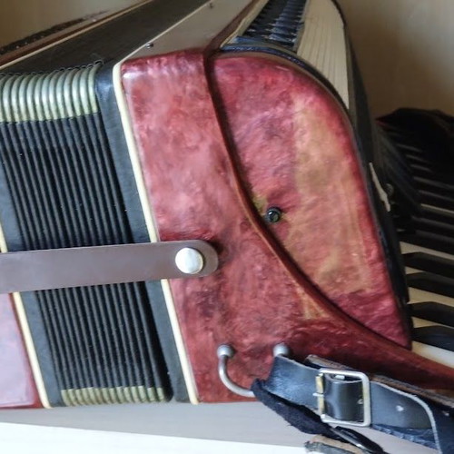 Vostok Accordion like new, red pearl vintage with case and books