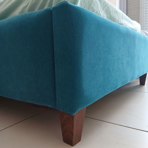Single bed with teal fabric headboard and mattress, like new