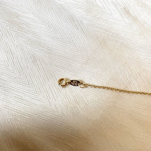 Al'Oro 9k gold bracelet with foot and eye charms