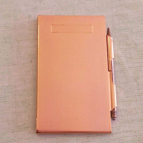 Vintage metal pocket notebook with integrated pencil used 1940-1950