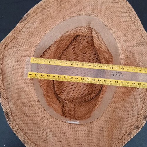 Straw-like hat used, tan with marks
