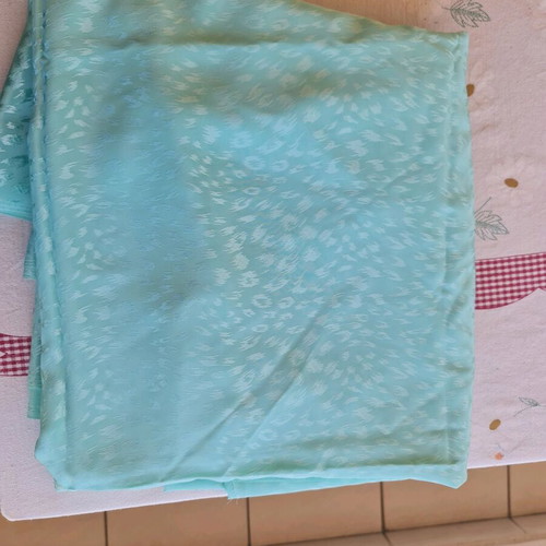 Fabric for dress in teal satin glossy