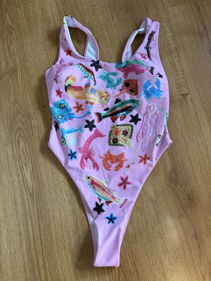 Women's one-piece swimsuit pink with colorful sea life print