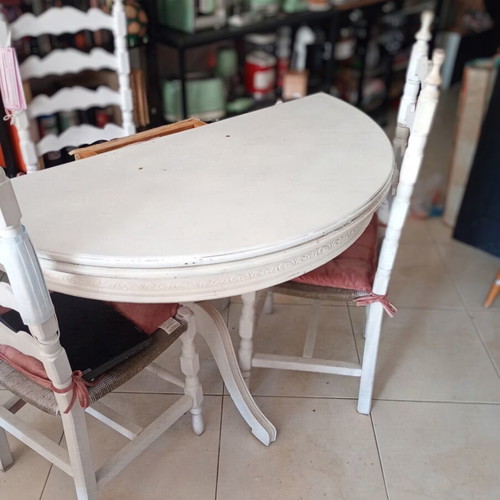 Vintage round dining table with 3 wooden chairs and rattan seats