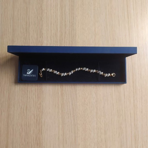 Swarovski bracelet like new, gold tone with crystals