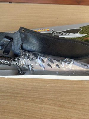 Hunting knife with steel blade new in packaging
