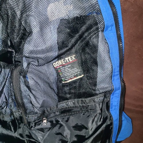 The North Face men's jacket used blue and black waterproof windbreaker