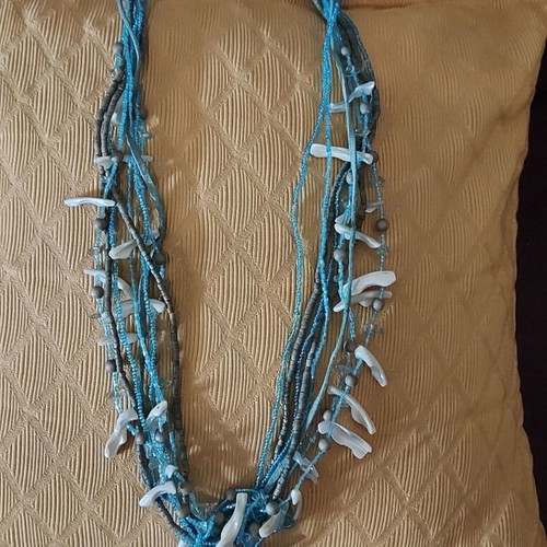 Long necklace used with beads and shells turquoise and white