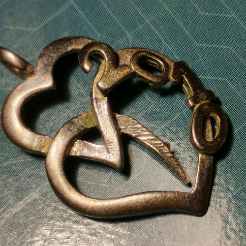 Silver necklace with two hearts and 2010 date used