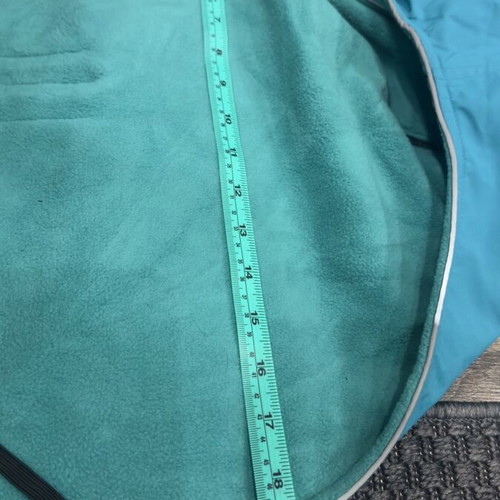 Waterproof dog jacket like new with fleece lining in petrol color