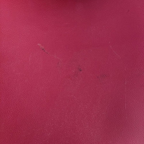 Red backpack used with broken zipper and mark