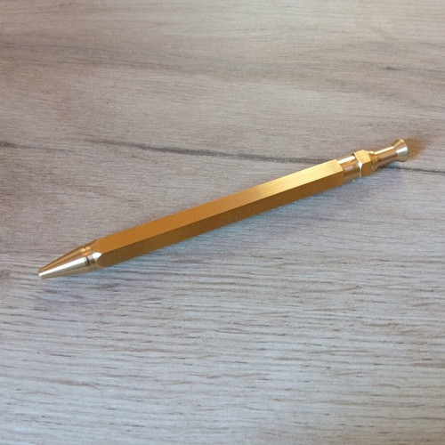 Hexagonal brass pen used, with g2 refill included