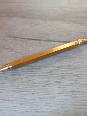 Hexagonal brass pen used, with g2 refill included