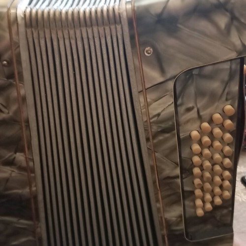 Old DIX accordion used with pearl keys and peeling
