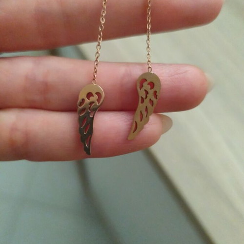 Silver earrings with rose gold wing symbol