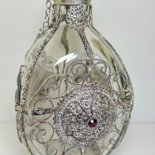 Vintage ornate handmade filigree glass bottle with red stones