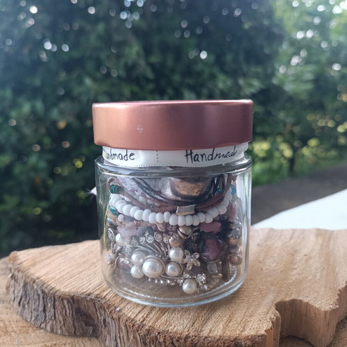 Jewellery jar with assorted used jewelry
